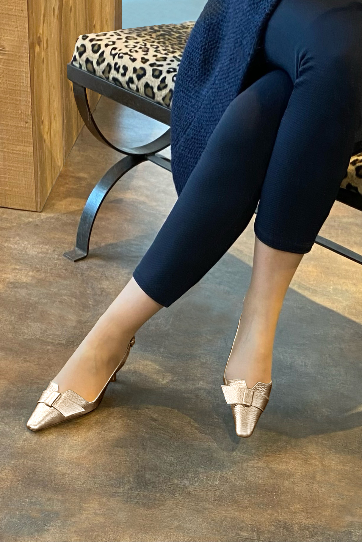 Tan beige women's slingback shoes. Tapered toe. Medium spool heels. Worn view - Florence KOOIJMAN